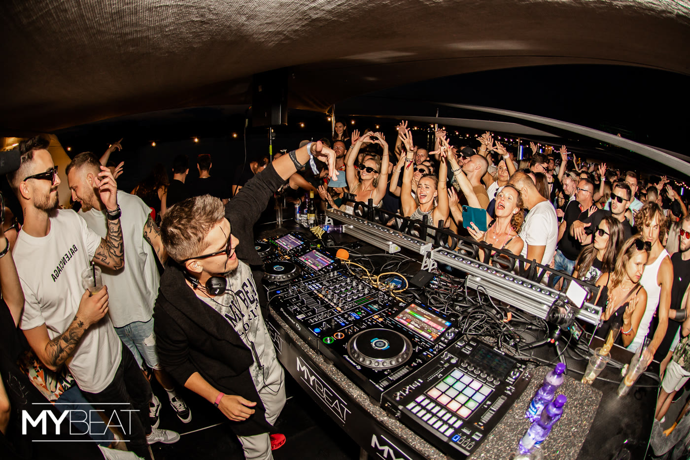 KNNY playing at MyBeat, with the crowd gathered around the decks